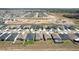 Wide aerial view displaying a vast residential community with uniform housing and developing landscape at 219 Summerlin Loop, Haines City, FL 33844