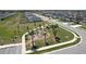 A green community park with playground equipment and a gazebo, and is located in a residential neighborhood at 219 Summerlin Loop, Haines City, FL 33844