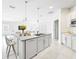 Stylish kitchen island with seating, granite countertops and stainless steel dishwasher at 219 Summerlin Loop, Haines City, FL 33844