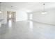 Spacious open-concept living area with tile flooring and plenty of natural light at 219 Summerlin Loop, Haines City, FL 33844