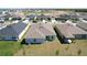 Aerial view of the home's backyard showing a well-maintained lawn and patio area at 219 Summerlin Loop, Haines City, FL 33844
