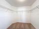 Walk-in closet with shelving, providing ample storage and organization at 219 Summerlin Loop, Haines City, FL 33844