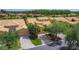 Aerial view of yellow homes with clay tile roofs and brick-paver driveways at 2502 Palm Tree Dr, Poinciana, FL 34759