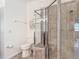 Clean bathroom with toilet and glass shower stall at 2502 Palm Tree Dr, Poinciana, FL 34759