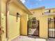 Enclosed brick-paver courtyard with iron gate at 2502 Palm Tree Dr, Poinciana, FL 34759