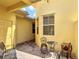 Private brick-paver courtyard with seating area at 2502 Palm Tree Dr, Poinciana, FL 34759