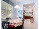 Cozy breakfast nook featuring a round table, decorative accents, and a window offering natural light at 2502 Palm Tree Dr, Poinciana, FL 34759