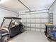 This garage has a new door with an automatic opener, space for parking and storage at 2502 Palm Tree Dr, Poinciana, FL 34759