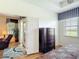 Bright bedroom showcases hardwood floors, a sliding door, and a view of the waterfront at 2502 Palm Tree Dr, Poinciana, FL 34759