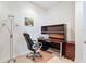 Office with desk, black leather chair, and chrome floor lamp at 2502 Palm Tree Dr, Poinciana, FL 34759