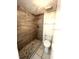 Bathroom features shower stall with dark wood tiling and tile floor at 2538 Citrus Club Ln # 105, Orlando, FL 32839