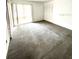Spacious bedroom with a large window and neutral carpeting at 2538 Citrus Club Ln # 105, Orlando, FL 32839