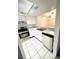 Well-lit kitchen with white cabinets, modern appliances and stylish granite countertops at 2538 Citrus Club Ln # 105, Orlando, FL 32839