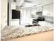 Functional kitchen with white cabinets, stainless steel appliances and granite countertops at 2538 Citrus Club Ln # 105, Orlando, FL 32839