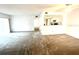 Open living room with carpeted flooring, neutral colors, and a view into the kitchen area at 2538 Citrus Club Ln # 105, Orlando, FL 32839