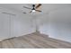 Bedroom featuring a ceiling fan, hardwood flooring, and closets at 2801 Palmyra Ct, St Cloud, FL 34772