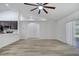 Bright, open living room featuring modern lighting and access to outdoor space at 2801 Palmyra Ct, St Cloud, FL 34772
