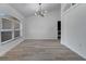 Bright living space with hardwood flooring, recessed lighting, and view into the laundry area at 2801 Palmyra Ct, St Cloud, FL 34772