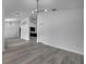 Open-concept living area features stylish lighting and hardwood flooring, creating a welcoming space at 2801 Palmyra Ct, St Cloud, FL 34772