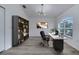 Bright office with stylish light fixture, built-in bookshelves, and large window at 2801 Palmyra Ct, St Cloud, FL 34772