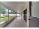 Screened-in patio with tiled floor, screen walls, and a view of the yard at 2801 Palmyra Ct, St Cloud, FL 34772