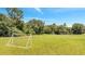 Outdoor shot of soccer field featuring soccer goals and greenery against a sunny blue sky at 2801 Palmyra Ct, St Cloud, FL 34772