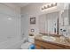 Well-maintained bathroom featuring a bathtub, shower, and vanity with countertop space for everyday needs at 2835 Oakwater Dr # 2835, Kissimmee, FL 34747