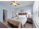 Comfortable bedroom boasts natural light and a view to the outdoors at 2835 Oakwater Dr # 2835, Kissimmee, FL 34747
