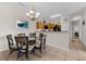Inviting dining space adjacent to the kitchen with stylish furnishings and ample natural light, ideal for gatherings at 2835 Oakwater Dr # 2835, Kissimmee, FL 34747