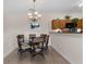 Cozy dining room featuring an elegant chandelier and a table set for six, perfect for Gathering meals at 2835 Oakwater Dr # 2835, Kissimmee, FL 34747