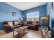 Comfortable living room with large window, cozy furniture and tile flooring at 2835 Oakwater Dr # 2835, Kissimmee, FL 34747