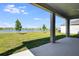 Covered back porch featuring view of community lake and neighborhood at 2943 Gavin Sky Dr, Kissimmee, FL 34744