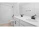 Bathroom featuring double sink vanity, white cabinets, and tub and shower combo at 2943 Gavin Sky Dr, Kissimmee, FL 34744