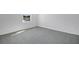 Bedroom with neutral carpet and a view of construction from the single window at 2943 Gavin Sky Dr, Kissimmee, FL 34744