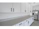 Bright kitchen features white cabinets, stainless steel appliances and stone countertops at 2943 Gavin Sky Dr, Kissimmee, FL 34744