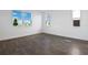 Sunny bedroom with multiple windows offering picturesque views and wood-look flooring at 2961 Gavin Sky Dr, Kissimmee, FL 34744