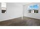 Bright bedroom with neutral walls and wood-look flooring, featuring large windows for natural light at 2961 Gavin Sky Dr, Kissimmee, FL 34744