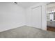 Cozy bedroom with plush carpeting and a closet, conveniently located near the adjacent bathroom at 2961 Gavin Sky Dr, Kissimmee, FL 34744