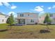 The backyard of this home features a covered patio and young trees at 2967 Gavin Sky Dr, Kissimmee, FL 34744