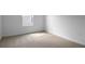Empty bedroom featuring neutral carpet, a window, and white walls at 2967 Gavin Sky Dr, Kissimmee, FL 34744