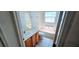 Well-lit bathroom with a single sink vanity, mirror, and tiled shower-tub combo at 300 Falling Water Dr, Kissimmee, FL 34759
