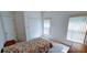 Bright bedroom with tile flooring, windows, and a comfortable bed with floral bedding at 300 Falling Water Dr, Kissimmee, FL 34759