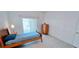 Inviting bedroom with a bed, dresser, and sliding doors for natural light at 300 Falling Water Dr, Kissimmee, FL 34759