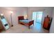 Bright bedroom with a comfortable bed and sliding glass doors to the outside at 300 Falling Water Dr, Kissimmee, FL 34759