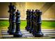 Close up view of an outdoor chess set with chess pieces on a chess board at 300 Falling Water Dr, Kissimmee, FL 34759