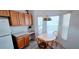 Bright dining nook with a round wooden table and built-in desk area at 300 Falling Water Dr, Kissimmee, FL 34759