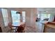 Cozy dining area with round table and chairs, filled with natural light at 300 Falling Water Dr, Kissimmee, FL 34759
