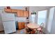 Inviting dining area with a round table and chairs, with kitchen adjacent at 300 Falling Water Dr, Kissimmee, FL 34759