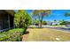Well-manicured lawn, professional landscaping, and charming single-story home in a suburban setting at 300 Falling Water Dr, Kissimmee, FL 34759