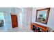 Bright hallway featuring tiled floors and decorative accents at 300 Falling Water Dr, Kissimmee, FL 34759